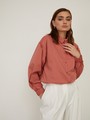 Рубашка с резинкой на манжетах, цвет: терракотовый Allweneed Рубашка с резинкой на манжетах. Свободного кроя с пышными рукавами.Модель выполнена из мягкой и приятной к телу ткани высокого качества. Отлично сочетается с джинсами mom-fit и юбками длины миди. Из обуви выбирайте изящные лодочки или обувь на плоском ходу.
На модели размер S