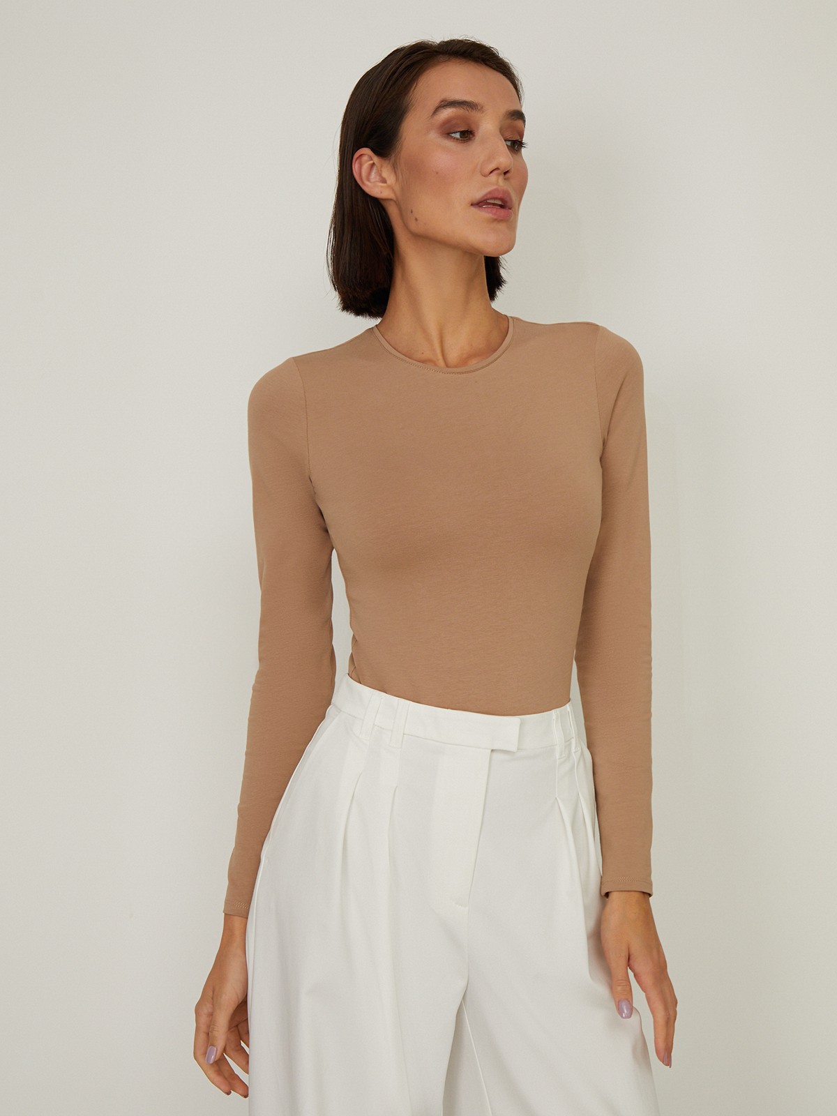 


Боди с эффектом второй кожи выполнен из тонкой трикотажной ткани. Длинные рукава, круглый вырез. Необходимая константа современного гардероба.

На модели размер XS