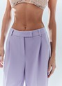 Брюки широкие полной длины, цвет: лавандовый Allweneed Брюки на средней посадке полной длины. Скрытая застёжка на молнию. Модель свободного кроя делает силуэт визуально стройнее. Приятная к телу костюмная ткань хорошо держит форму и обеспечивает правильную посадку по фигуре. Мы рекомендуем сочетать брюки с жакетом из новогодней коллекции, дополняя комплект броскими украшениями в праздничную ночь и топом в рубчик в будничной жизни. Представлены в трёх цветах: сиреневый рассказывает о тихом утре 1 января, красный апельсин символизирует мандарины и гирлянды, а белый это чистый зимний снег.