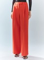 Брюки широкие полной длины, цвет: коралловый Allweneed Брюки на средней посадке полной длины. Скрытая застёжка на молнию. Модель свободного кроя делает силуэт визуально стройнее. Приятная к телу костюмная ткань хорошо держит форму и обеспечивает правильную посадку по фигуре. Мы рекомендуем сочетать брюки с жакетом из новогодней коллекции, дополняя комплект броскими украшениями в праздничную ночь и топом в рубчик в будничной жизни. Представлены в трёх цветах: сиреневый рассказывает о тихом утре 1 января, красный апельсин символизирует мандарины и гирлянды, а белый это чистый зимний снег.