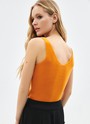 Топ вязаный, цвет: рыжий Allweneed
Топ из нежного трикотажа. Наш бестселлер в новых цветах. Благодаря вискозе вам будет комфортно даже жарким днём. Пряжа дарит приятные тактильные ощущения. Рекомендуем носить как альтернативу футболкам.